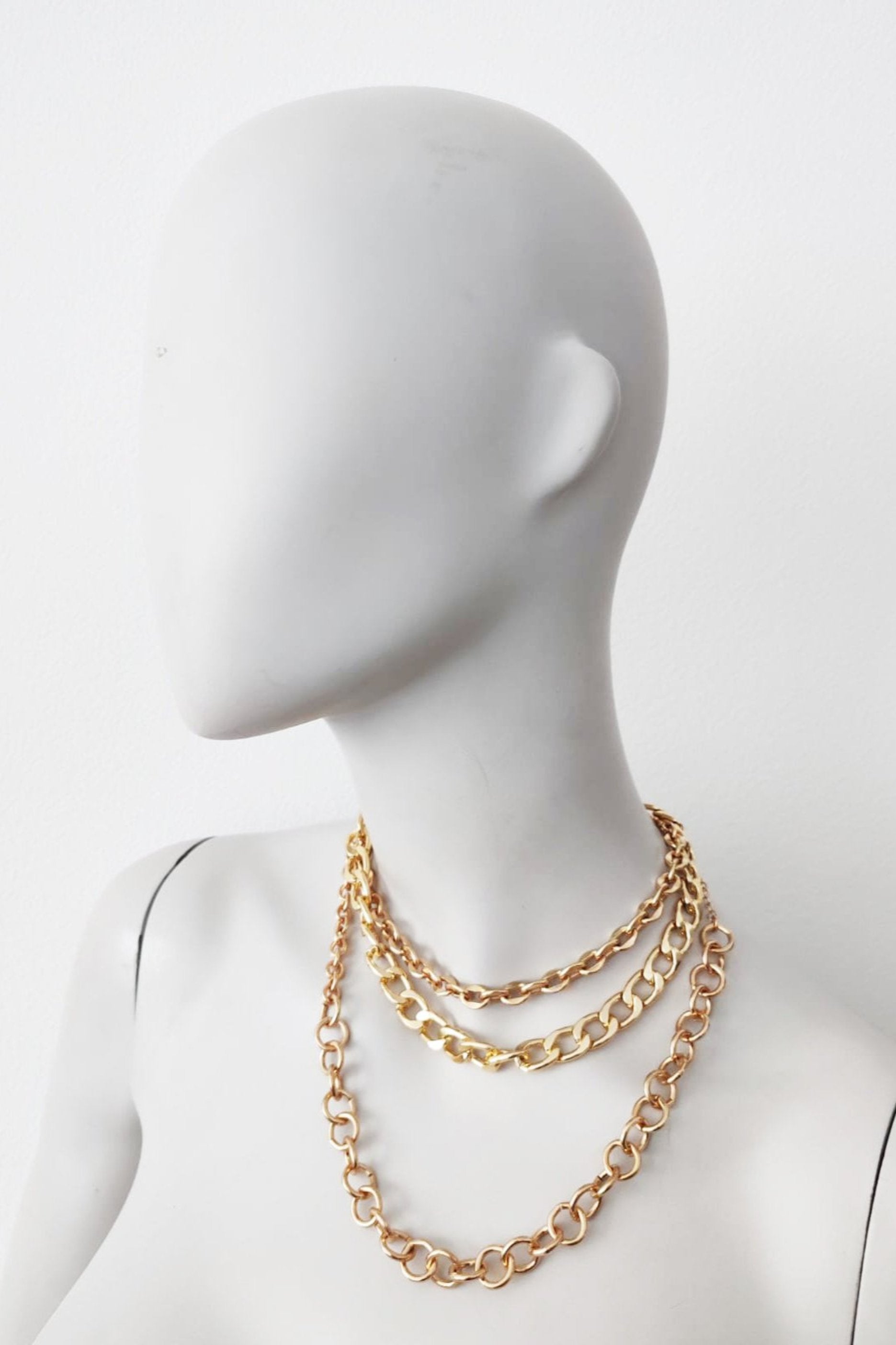 Layered gold chain necklaces